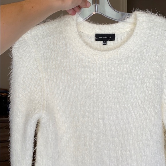 MAJORELLE fuzzy crop top with side cut outs.